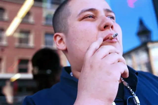 A fresh-faced smoker takes a drag in Boston in 2000